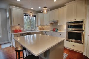 Open kitchen with countertops Granite countertops from Crowley's Granite in Portland OR & Vancouver WA