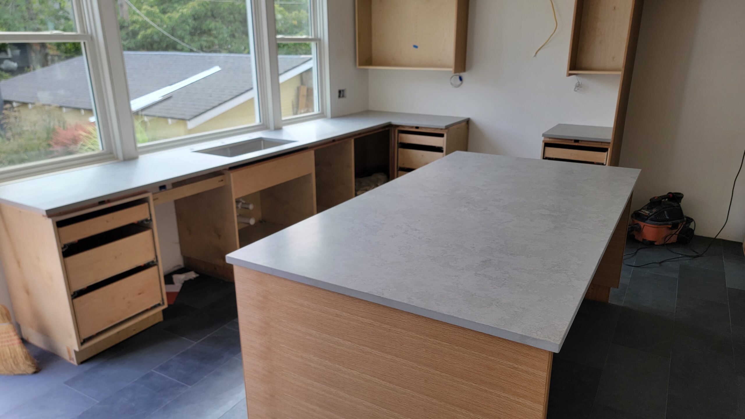 Light grey honed quartz countertops installed by Crowley's